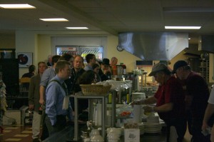 Maine People's Alliance activists wait in line for food at Cross Cafe in Augusta.