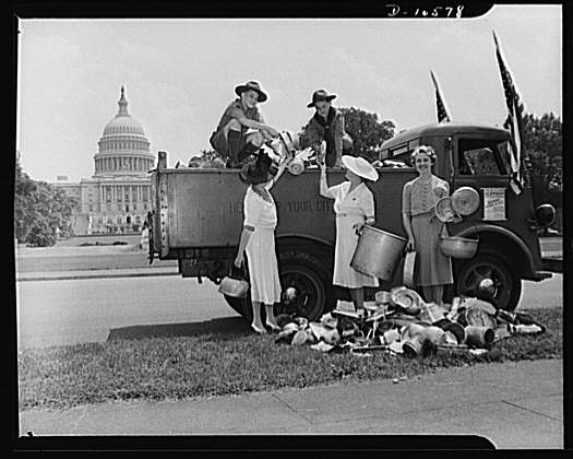 U.S. Sen. Margaret Chase Smith (R-Maine) is pictured above unloading tin-ware with some Boy Scouts. (Source: Library of Congress)