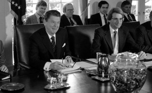 David Stockman (right) with Ronald Reagan at a 1981 Cabinet meeting to discuss the federal budget. (Jeff Taylor/AP)