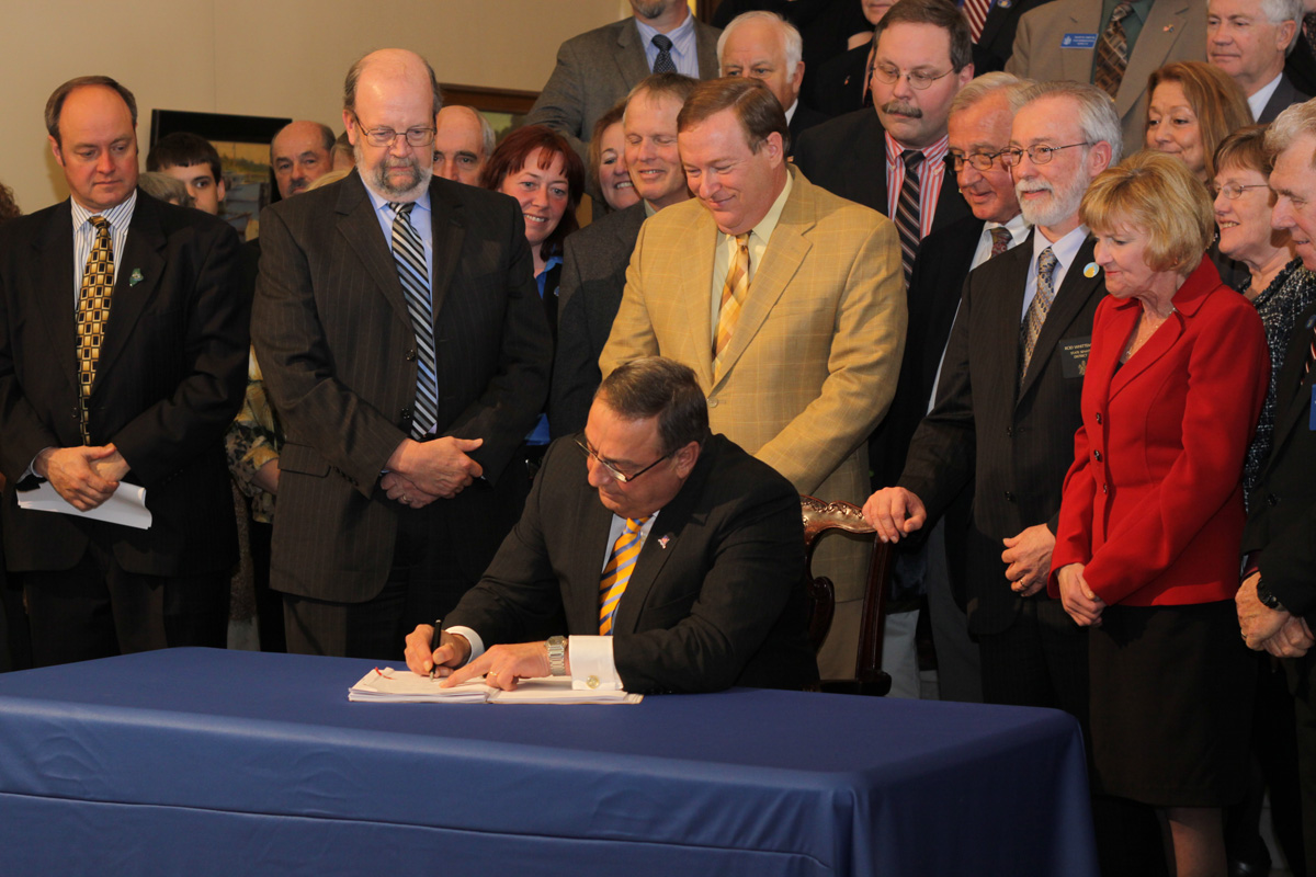 Gov. Paul LePage signed healthcare insurance reform legislation on